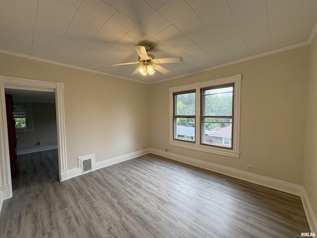 2704 N Dechman Ave, Peoria, IL 61603 - unfurnished room featuring crown molding, wood finished floors, baseboards, and a ceiling fan