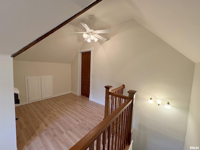 2704 N Dechman Ave, Peoria, IL 61603 - additional living space with lofted ceiling, a ceiling fan, and light wood-style floors
