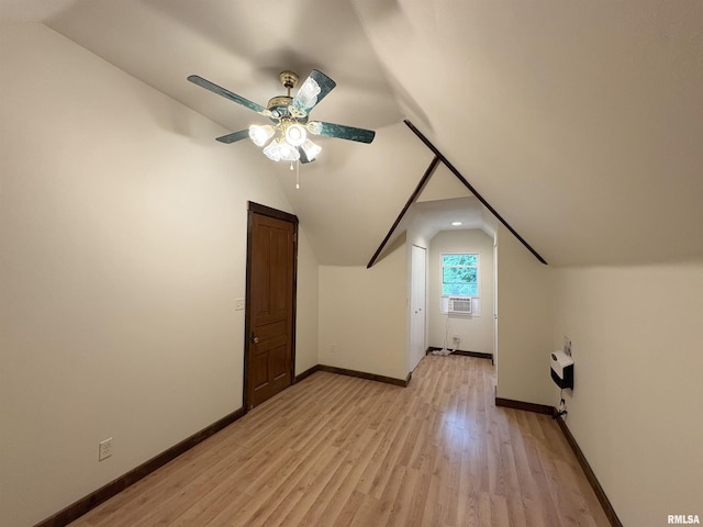 2704 N Dechman Ave, Peoria, IL 61603 - additional living space featuring lofted ceiling, ceiling fan, light wood finished floors, baseboards, and cooling unit