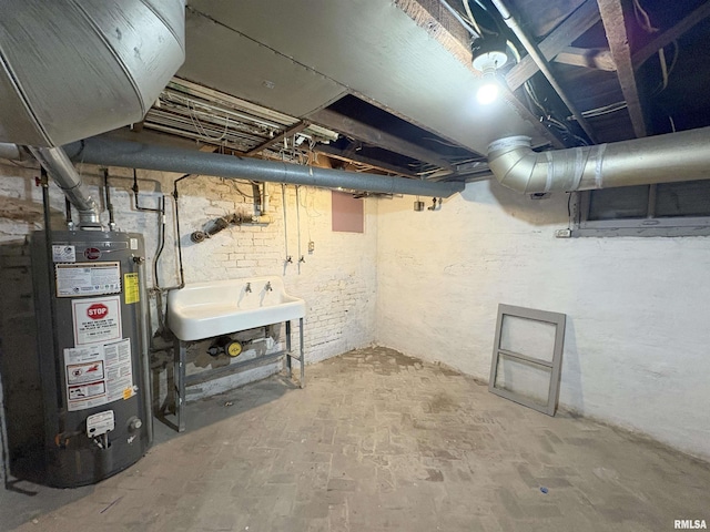 2704 N Dechman Ave, Peoria, IL 61603 - unfinished basement featuring water heater and a sink