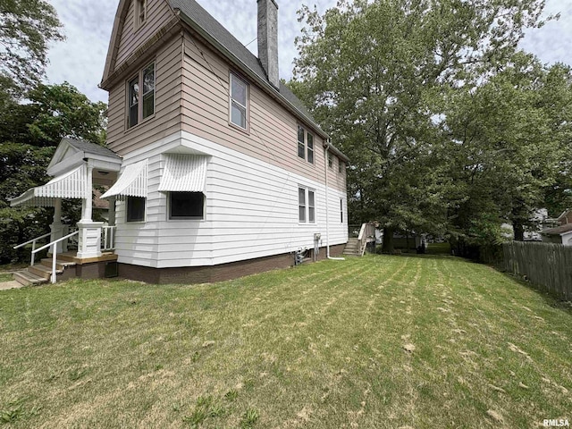 2704 N Dechman Ave, Peoria, IL 61603 - view of side of property with a chimney