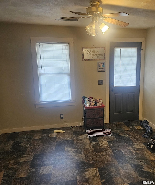 640 Grant Pl, Canton, IL 61520 - entrance foyer with a ceiling fan and baseboards