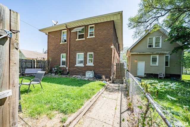2405 N Sheridan Rd, Peoria, IL 61604 - rear view of property featuring brick siding
