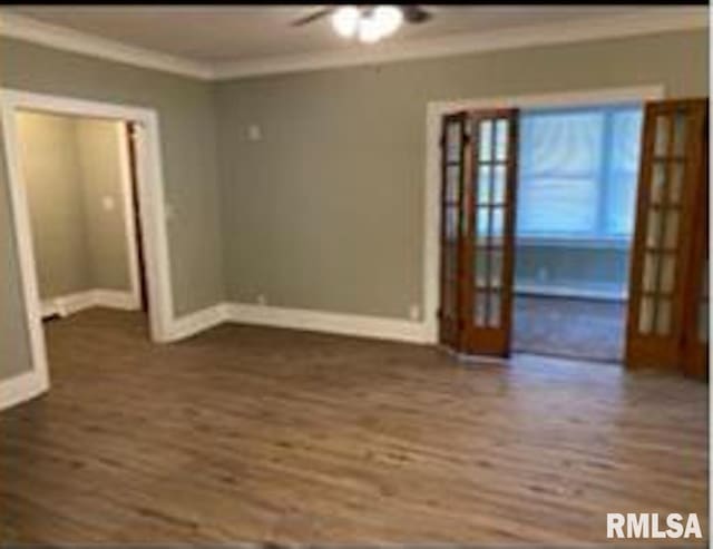 2405 N Sheridan Rd, Peoria, IL 61604 - unfurnished room with crown molding, dark wood finished floors, french doors, baseboards, and a ceiling fan