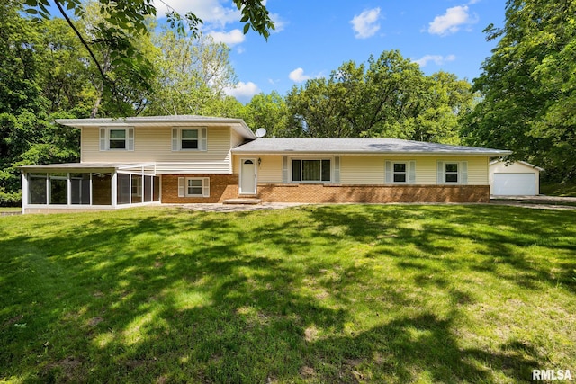 252 Santa Fe Trl, East Peoria, IL 61611 - split level home with brick siding, a sunroom, a front yard, and an outbuilding