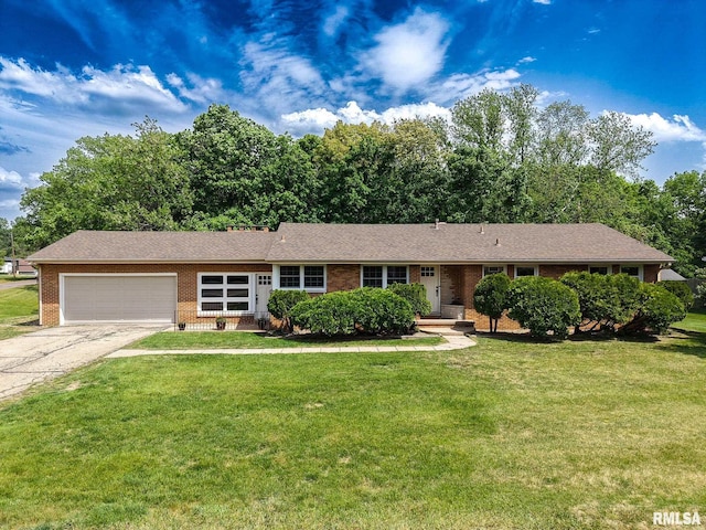 714 Arnold Rd, East Peoria, IL 61611 - single story home with brick siding, an attached garage, driveway, and a front yard