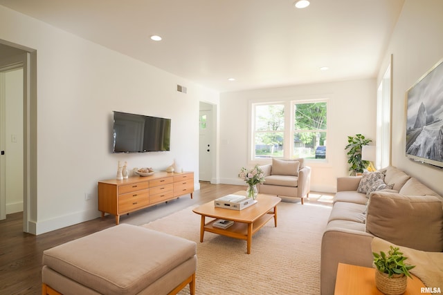 living room with wood finished floors, recessed lighting, and baseboards