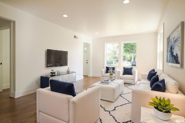 living room with wood finished floors, recessed lighting, and baseboards