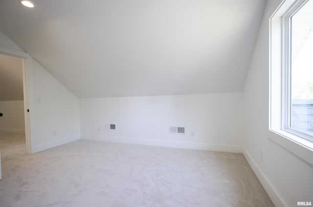 bonus room with vaulted ceiling, light carpet, baseboards, and recessed lighting