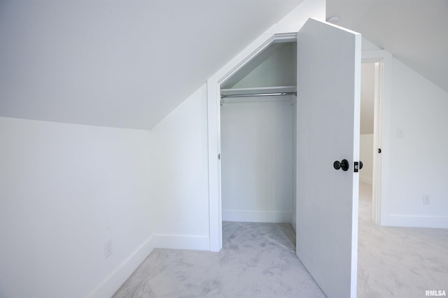 bonus room with carpet floors, vaulted ceiling, and baseboards
