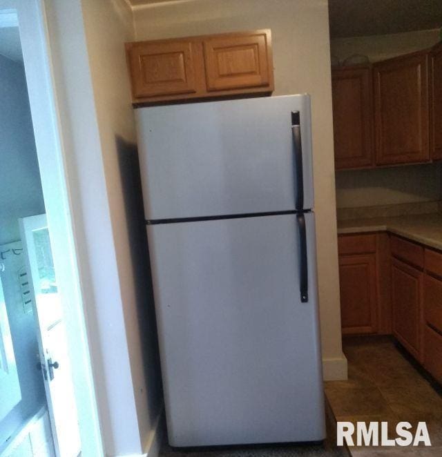 129 Pierson St, East Peoria, IL 61611 - kitchen with freestanding refrigerator and light countertops