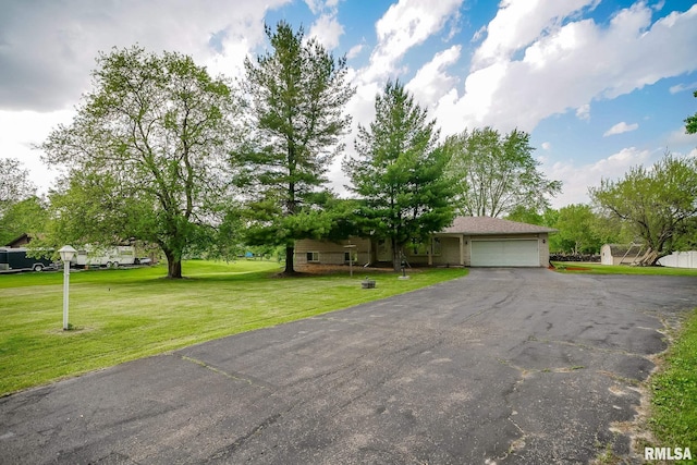 1529 W Richmar Rd, Peoria, IL 61615 - obstructed view of property with an attached garage, driveway, a front lawn, and brick siding
