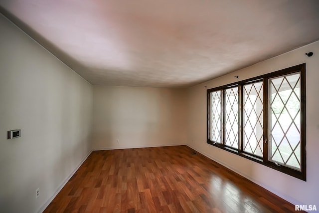 1529 W Richmar Rd, Peoria, IL 61615 - empty room with wood finished floors and baseboards