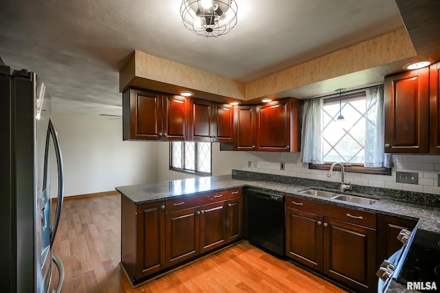 1529 W Richmar Rd, Peoria, IL 61615 - kitchen with black dishwasher, a sink, stainless steel fridge with ice dispenser, a peninsula, and light wood-type flooring