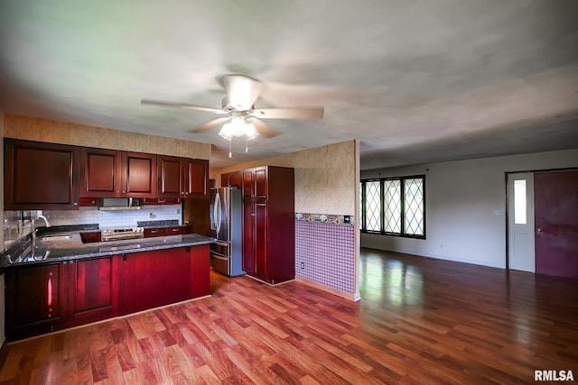 1529 W Richmar Rd, Peoria, IL 61615 - kitchen featuring stainless steel appliances, open floor plan, reddish brown cabinets, a peninsula, and a ceiling fan
