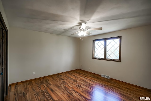 1529 W Richmar Rd, Peoria, IL 61615 - spare room with ceiling fan, wood finished floors, and baseboards