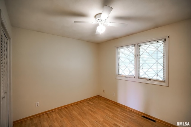 1529 W Richmar Rd, Peoria, IL 61615 - unfurnished bedroom with a closet, light wood-type flooring, baseboards, and a ceiling fan