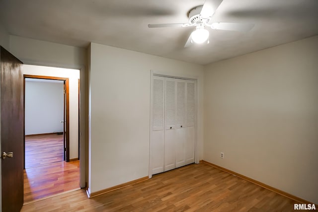 1529 W Richmar Rd, Peoria, IL 61615 - unfurnished bedroom featuring light wood-type flooring, baseboards, a closet, and ceiling fan