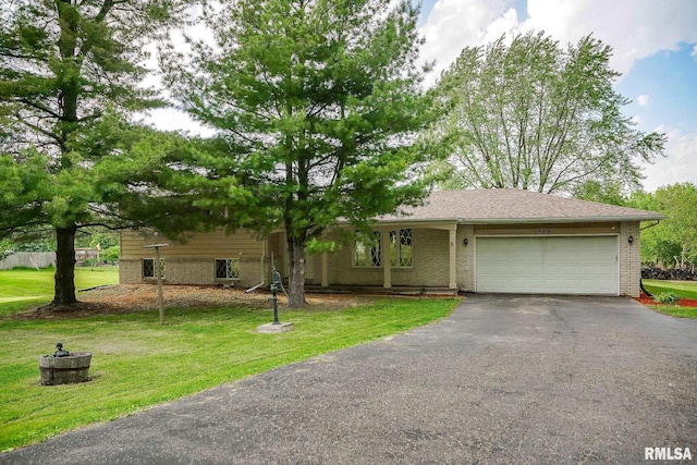1529 W Richmar Rd, Peoria, IL 61615 - view of front facade featuring asphalt driveway, an attached garage, a front lawn, and brick siding