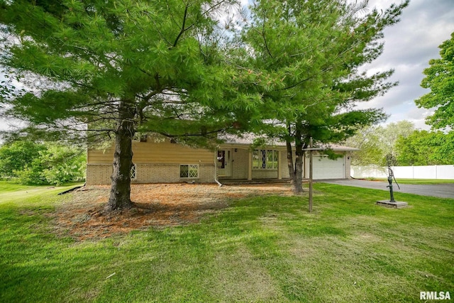 1529 W Richmar Rd, Peoria, IL 61615 - view of front of home with brick siding, asphalt driveway, and an attached garage