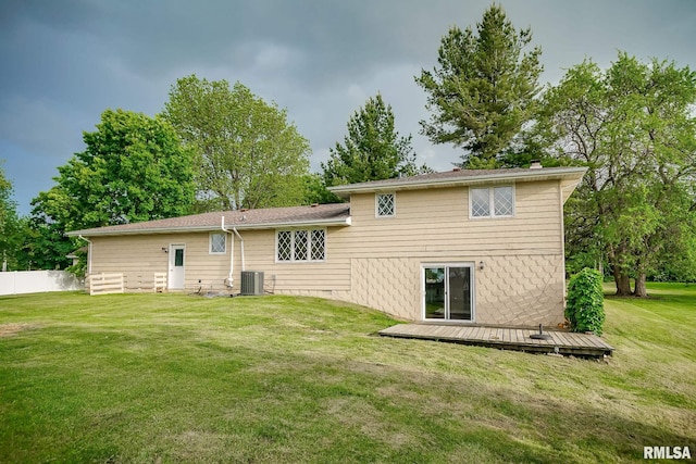 1529 W Richmar Rd, Peoria, IL 61615 - back of property featuring a deck, central air condition unit, and a chimney