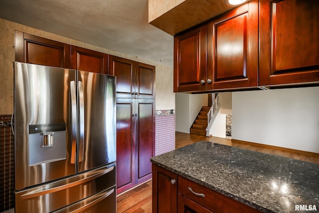 1529 W Richmar Rd, Peoria, IL 61615 - kitchen featuring stainless steel fridge, dark wood-style flooring, and dark stone countertops