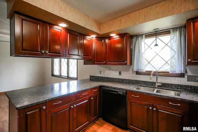 1529 W Richmar Rd, Peoria, IL 61615 - kitchen featuring dishwasher, a sink, a peninsula, light wood-style floors, and reddish brown cabinets