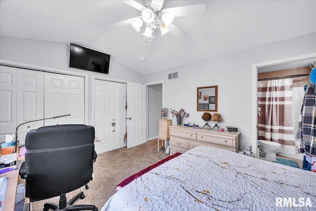 bedroom featuring multiple closets, carpet, vaulted ceiling, ceiling fan, and an office area