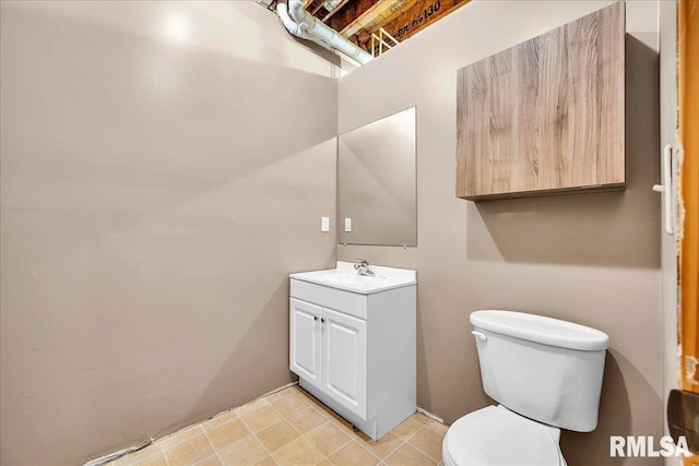 bathroom with toilet and vanity