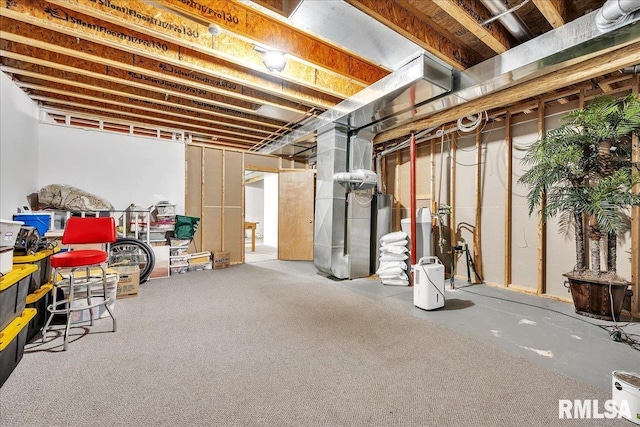 unfinished below grade area featuring heating unit