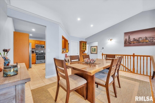 dining space with light tile patterned floors, vaulted ceiling, and recessed lighting