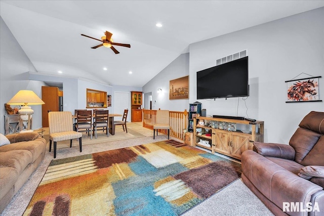 living area featuring lofted ceiling, a ceiling fan, light colored carpet, and recessed lighting