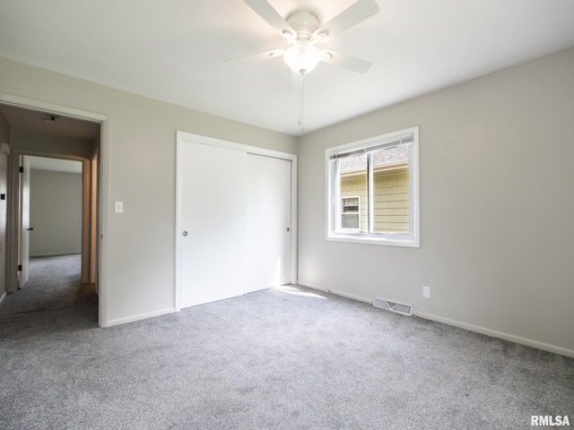 3509 S Dorothy Ct, Bartonville, IL 61607 - unfurnished bedroom with carpet, a closet, baseboards, and a ceiling fan