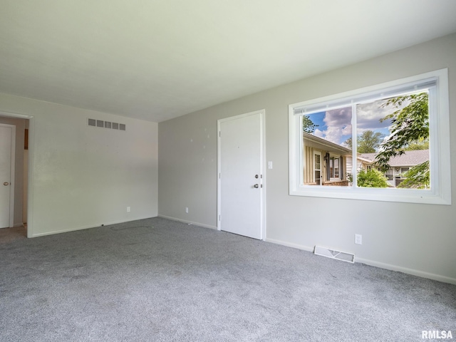 3509 S Dorothy Ct, Bartonville, IL 61607 - unfurnished living room with carpet floors and baseboards