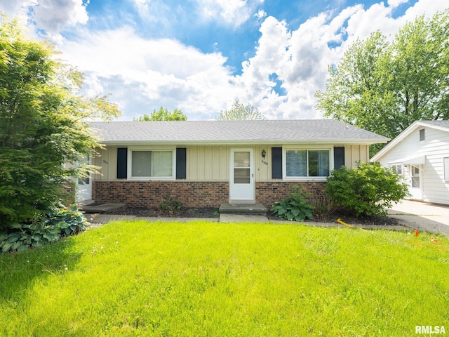 3509 S Dorothy Ct, Bartonville, IL 61607 - view of front of house with brick siding, a front lawn, and board and batten siding