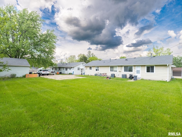 3509 S Dorothy Ct, Bartonville, IL 61607 - back of property featuring a yard and central AC unit