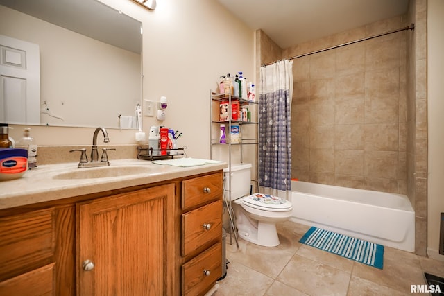 full bath featuring tile patterned floors, toilet, vanity, and shower / bath combo with shower curtain