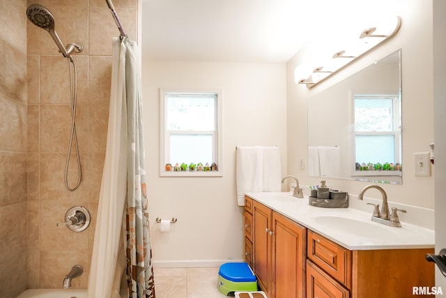 full bathroom with double vanity, tile patterned flooring, shower / bathtub combination with curtain, and baseboards