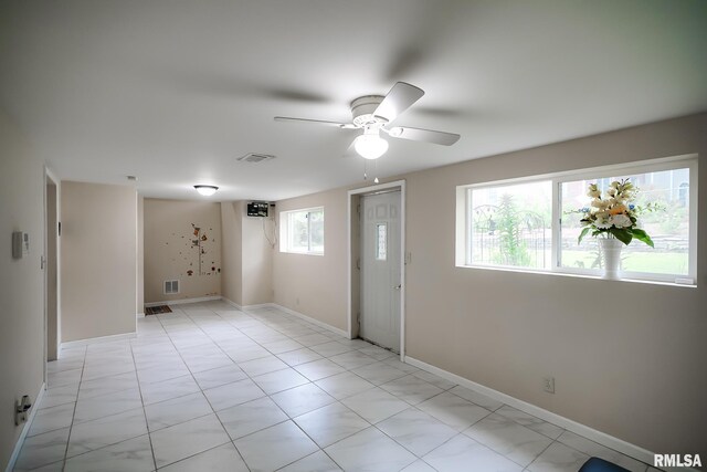 unfurnished room with a ceiling fan