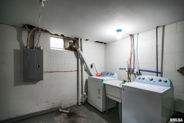 clothes washing area featuring independent washer and dryer and electric panel