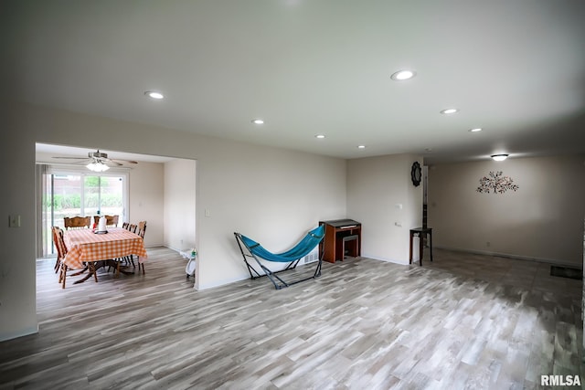 living area featuring wood finished floors, recessed lighting, ceiling fan, and baseboards