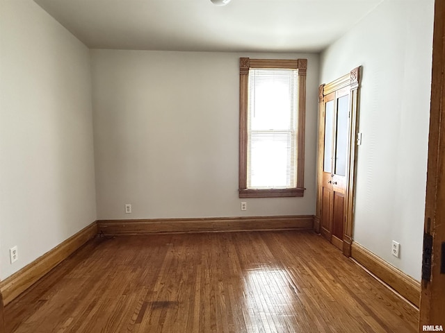 844 Walnut Rd, La Salle, IL 61354 - empty room with dark wood-type flooring and baseboards
