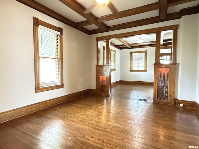 844 Walnut Rd, La Salle, IL 61354 - unfurnished living room with coffered ceiling, hardwood / wood-style flooring, beamed ceiling, baseboards, and decorative columns