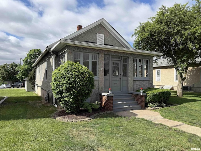 844 Walnut Rd, La Salle, IL 61354 - bungalow-style home featuring a front lawn and a chimney