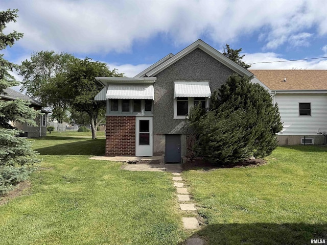 844 Walnut Rd, La Salle, IL 61354 - rear view of house with a lawn and brick siding