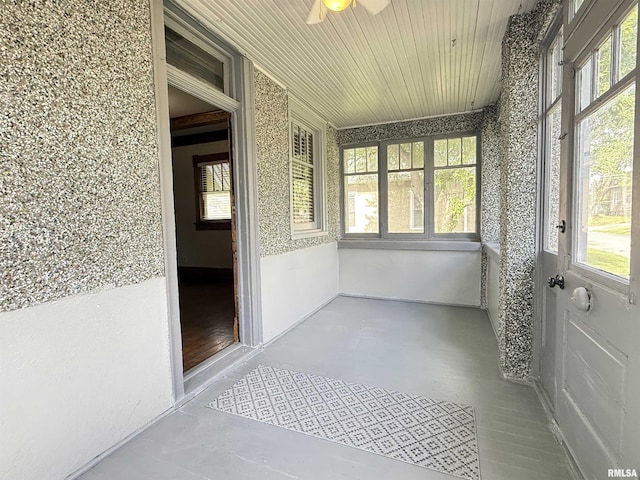 844 Walnut Rd, La Salle, IL 61354 - unfurnished sunroom featuring healthy amount of natural light, concrete flooring, and wooden ceiling