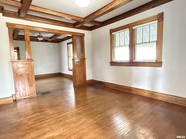 844 Walnut Rd, La Salle, IL 61354 - unfurnished room featuring wood finished floors, healthy amount of natural light, coffered ceiling, beam ceiling, and baseboards