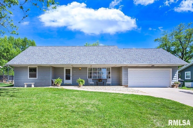 1504 Kern Rd, Washington, IL 61571 - view of front of home featuring a front yard, an attached garage, concrete driveway, and a shingled roof