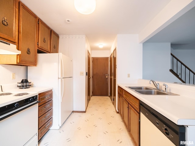 1020 Florence Ave, Pekin, IL 61554 - kitchen with white appliances, brown cabinets, light countertops, light floors, and under cabinet range hood