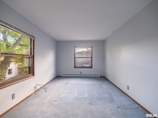 1020 Florence Ave, Pekin, IL 61554 - carpeted empty room with baseboard heating and baseboards